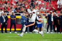 Chicago Bears quarterback Tyson Bagent runs in the second half of an NFL preseason football aga ...