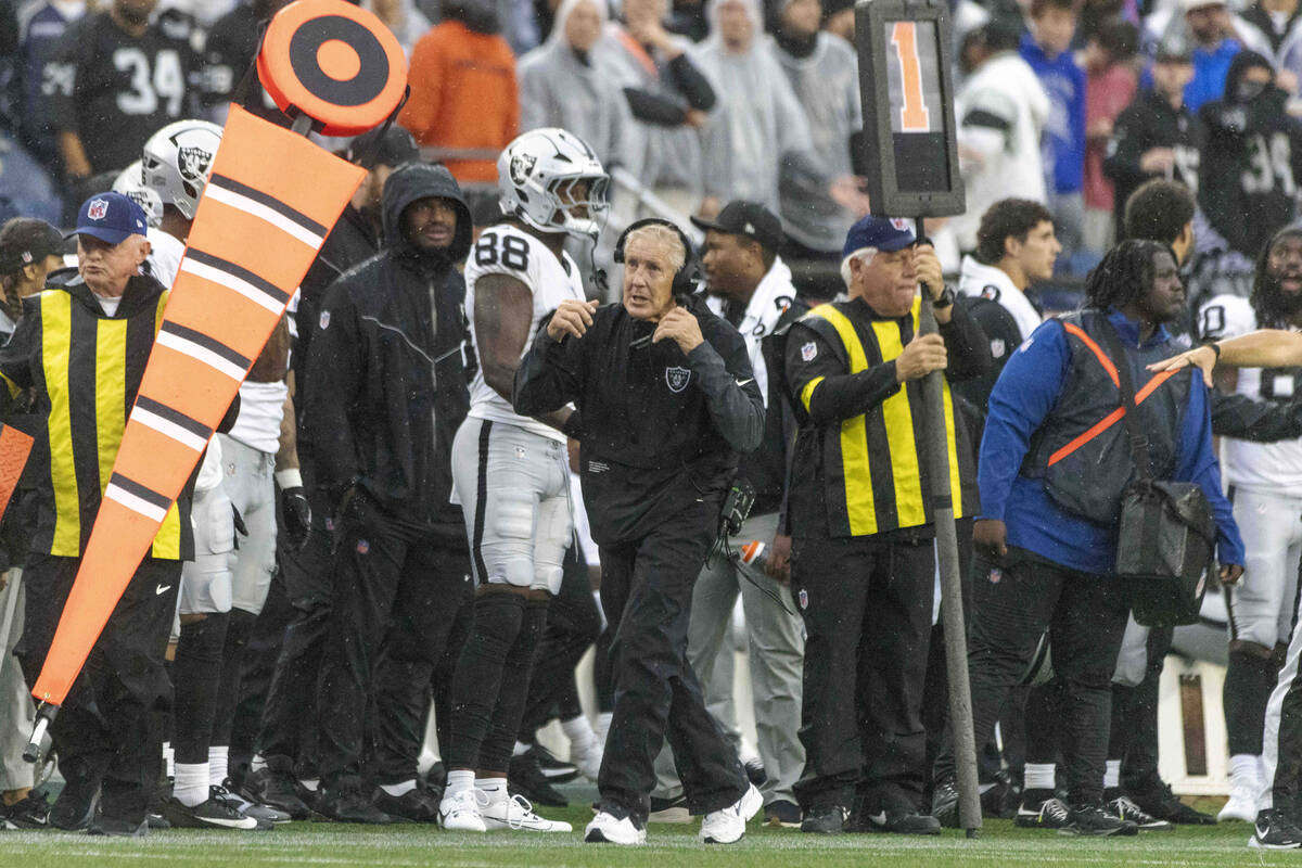 Raiders head coach Pete Carroll walks the sideline during the second half of an NFL game agains ...