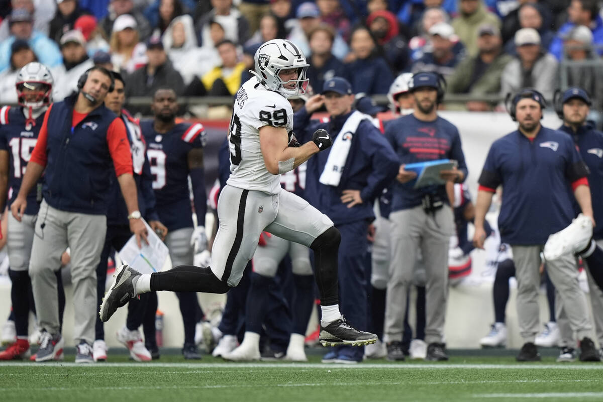 Las Vegas Raiders tight end Brock Bowers (89) runs with the ball against the New England Patrio ...