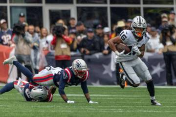 Raiders wide receiver Jakobi Meyers (16) takes off after making a catch as New England Patriots ...