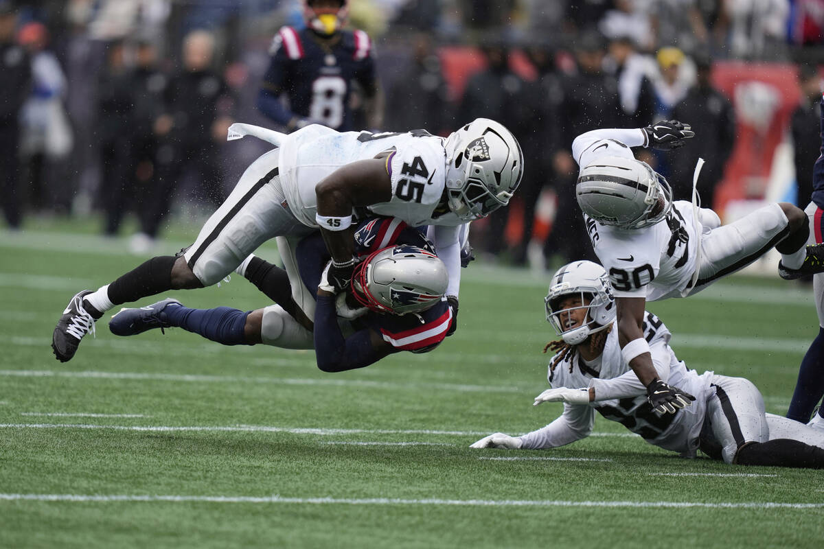 Las Vegas Raiders linebacker Devin White (45) tackles New England Patriots wide receiver Kaysho ...