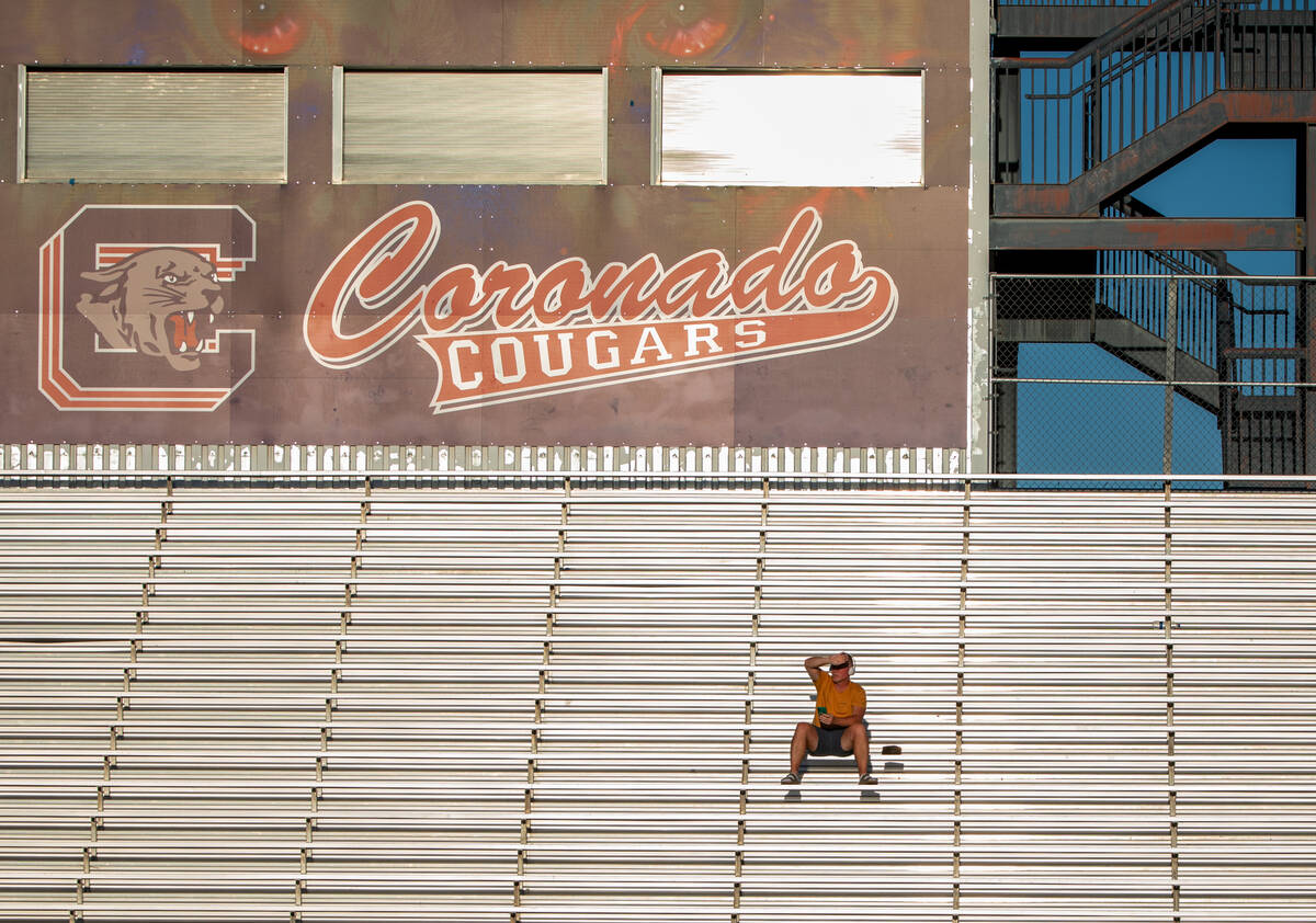 A lone fan sits in the away section during a matchup between Coronado and Las Vegas High School ...