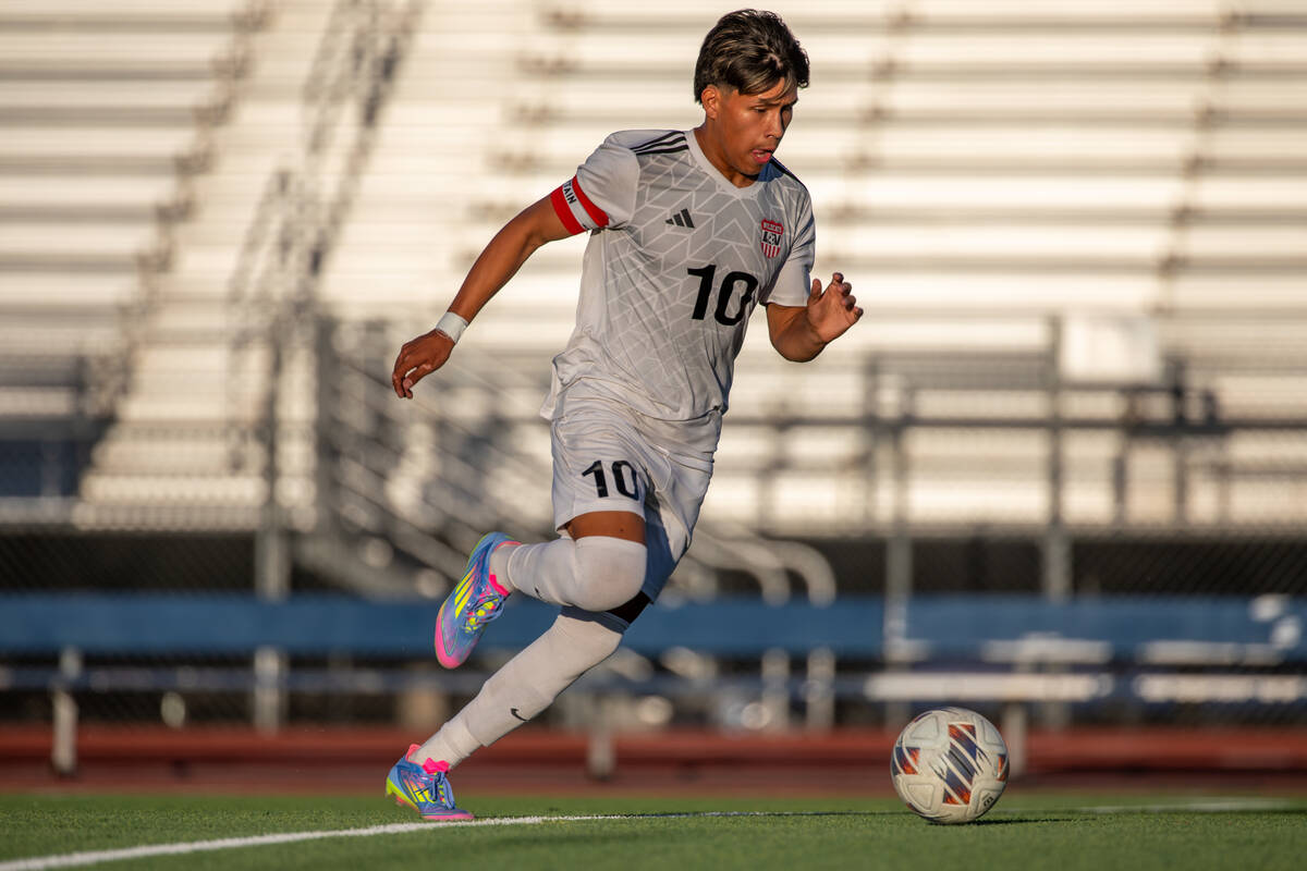 Las Vegas midfielder Anthony Cardenas takes the ball upfield at the beginning of a soccer match ...