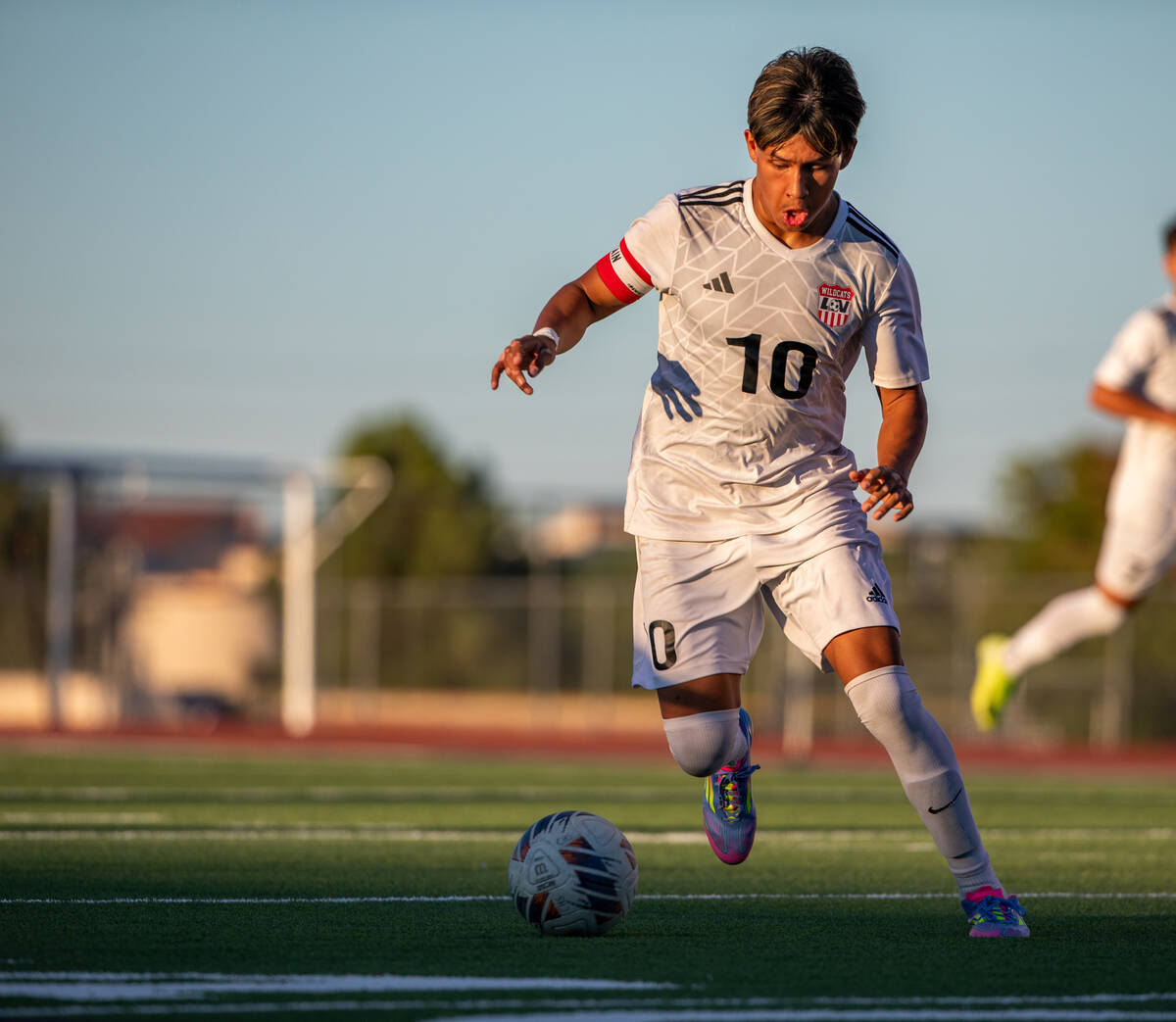 Las Vegas midfielder Anthony Cardenas takes the ball upfield at the beginning of a soccer match ...