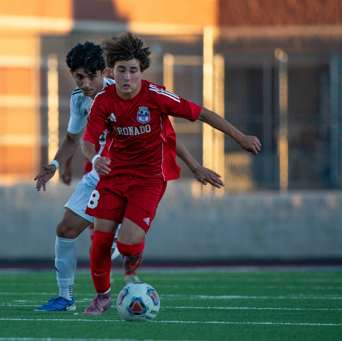 Coronado midfielder Josh Pineda (18) takes the ball upfield during a soccer match at Coronado H ...