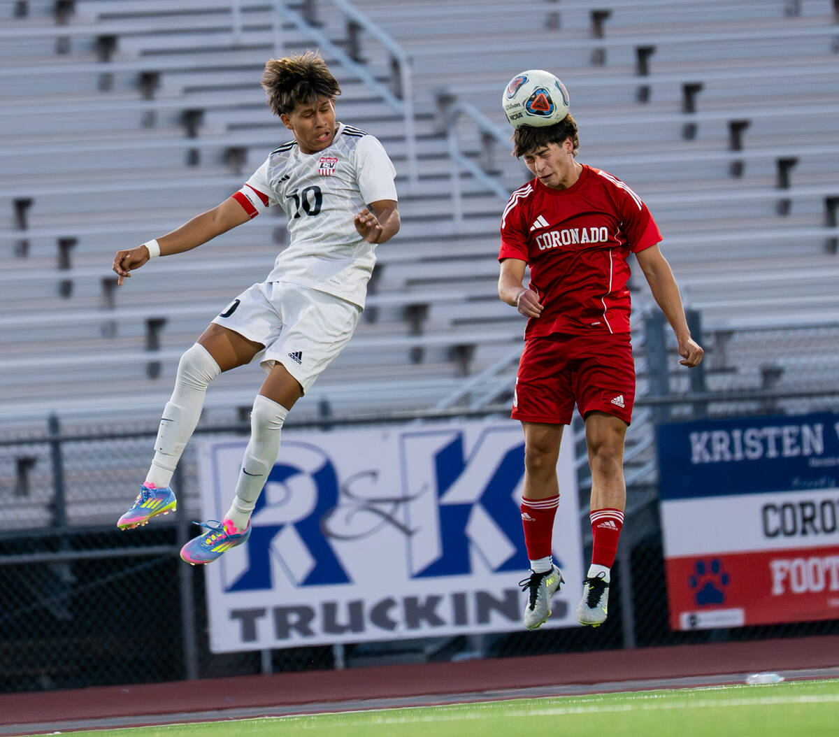 Anthony Cardenas (10) attempts to block Coronado from heading the ball during a soccer match at ...