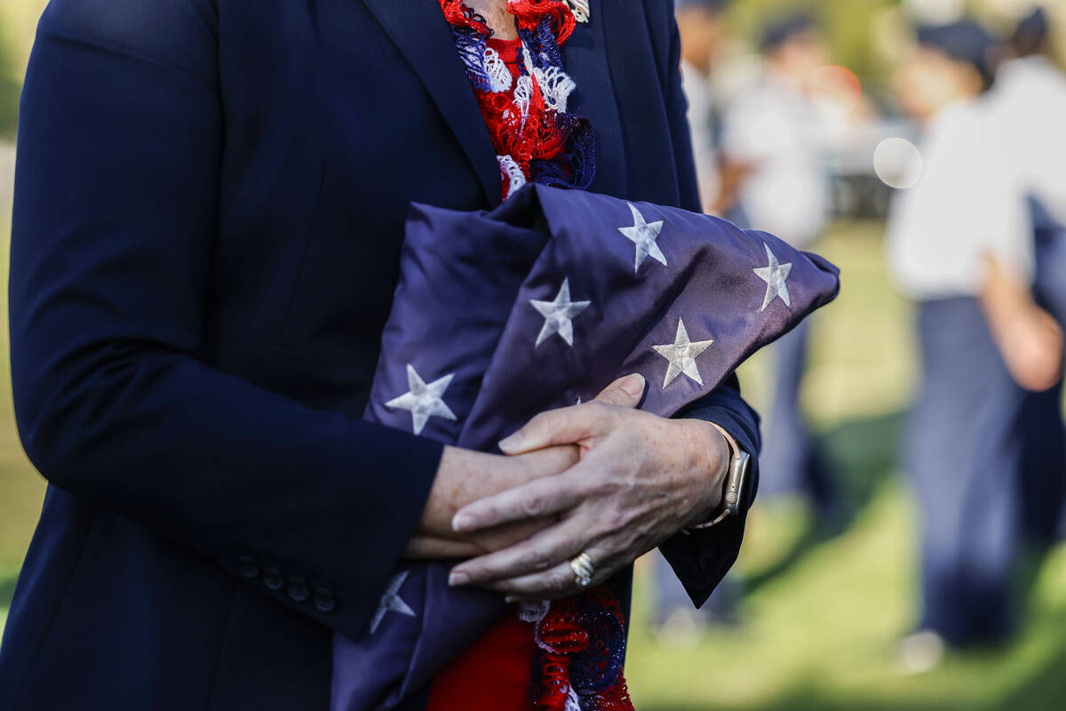Palo Verde teacher Carol Campbell holds an American flag she was presented with during the scho ...
