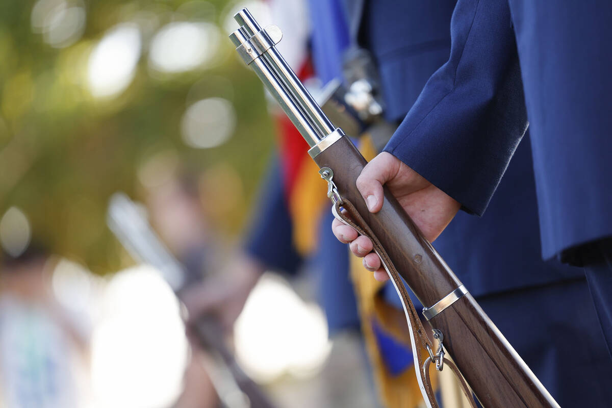 The Palo Verde High School ROTC color guard stands at rest before the start of the school&#x201 ...