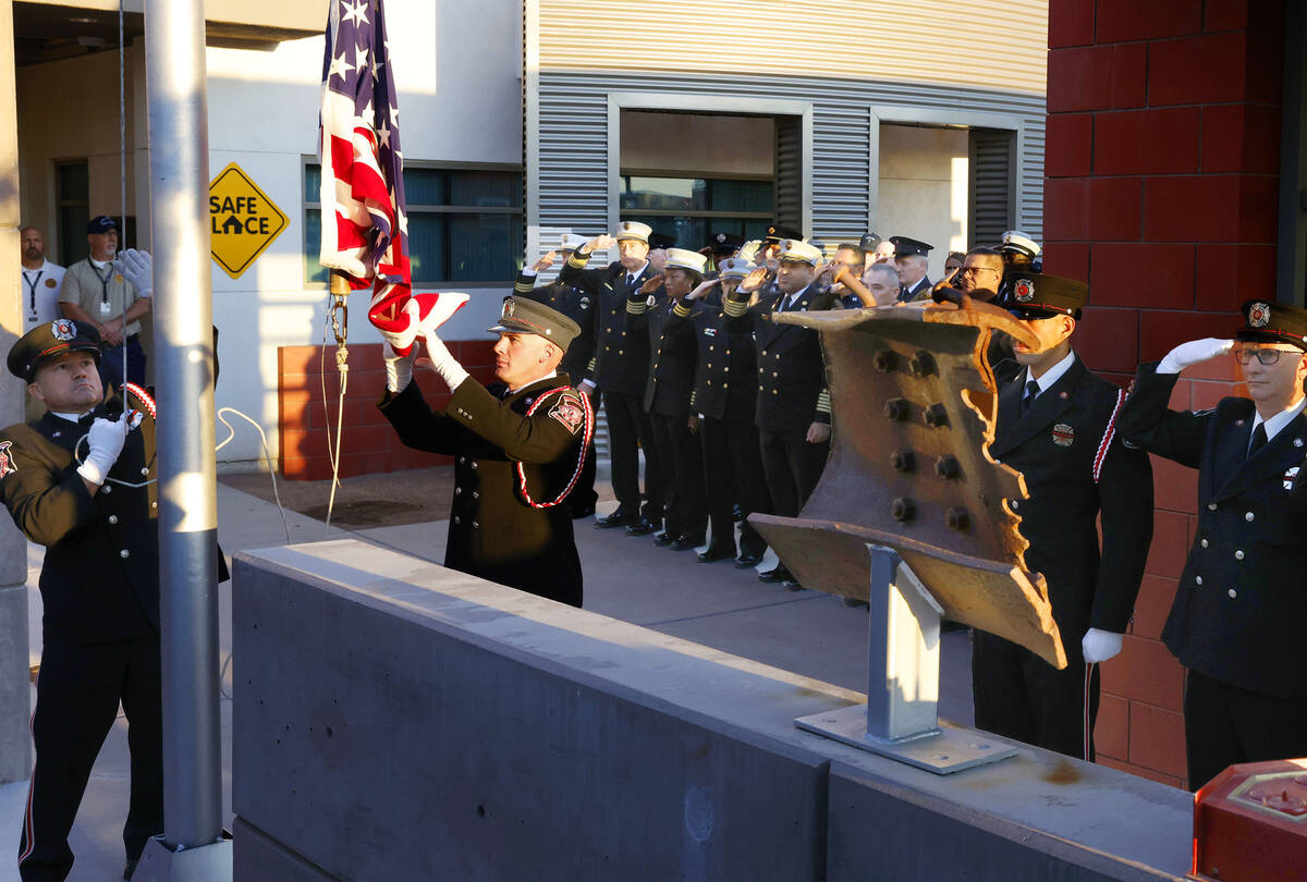 A piece of structural steel from the World Trade Center, right, is displayed as Joseph DiGaetan ...