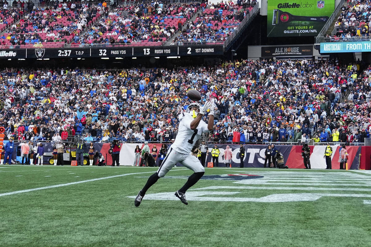 Las Vegas Raiders wide receiver Tre Tucker (1) catches a pass for a touchdown against the New E ...