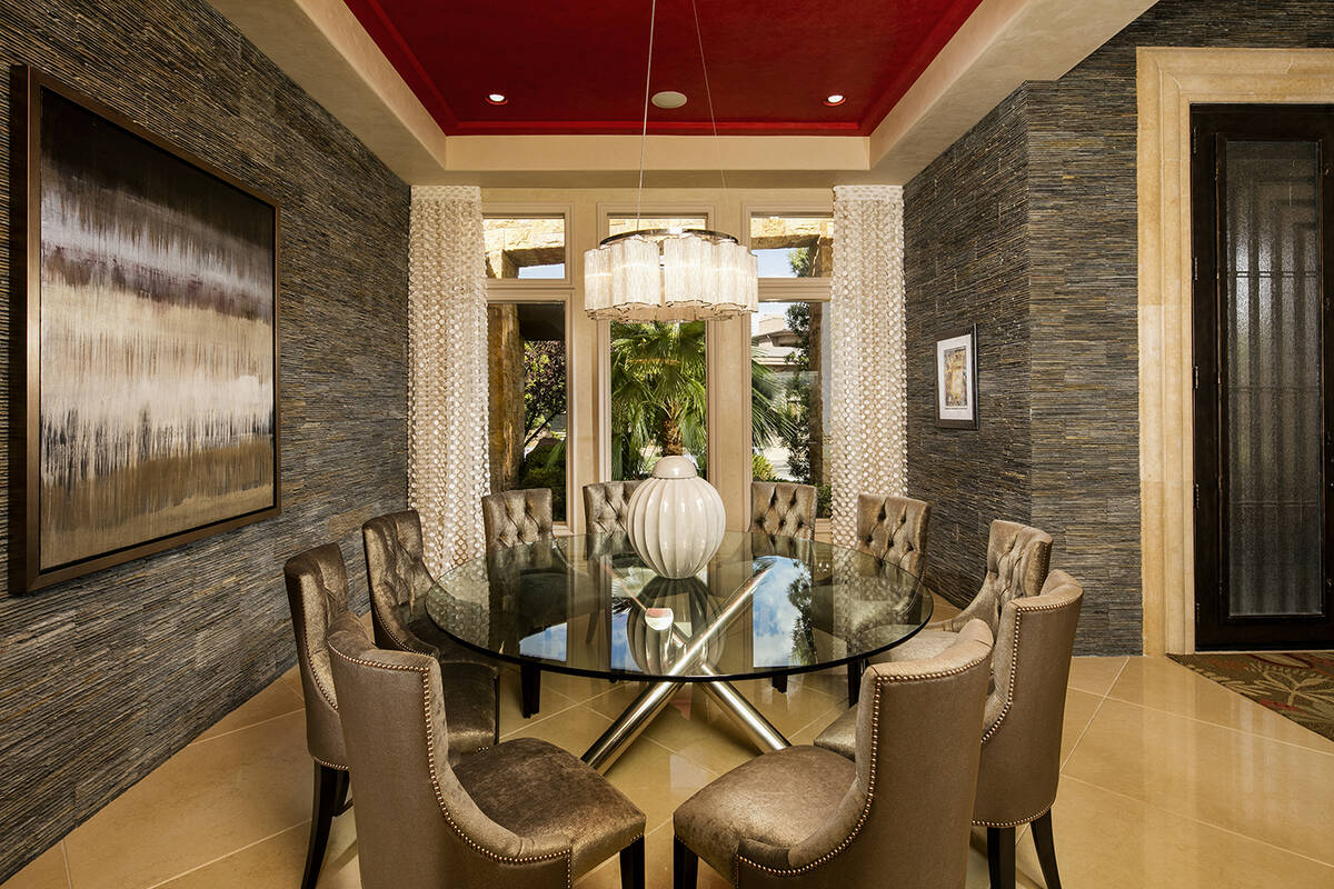 This single-story residence showcases a dining room with high ceilings and designer finishes. ...