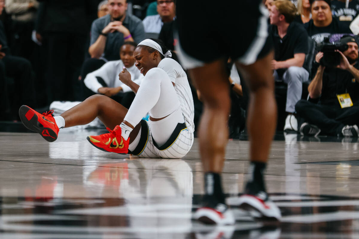 Chicago Sky forward Michaela Onyenwere (12) reacts after falling to the ground during the first ...