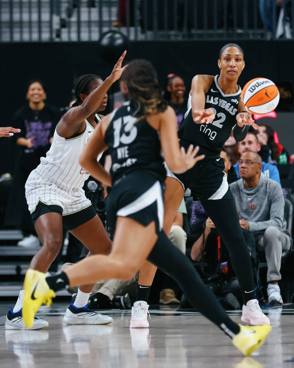 Aces center A'ja Wilson (22) passes to Aces guard Aaliyah Nye (13) during the first half o ...