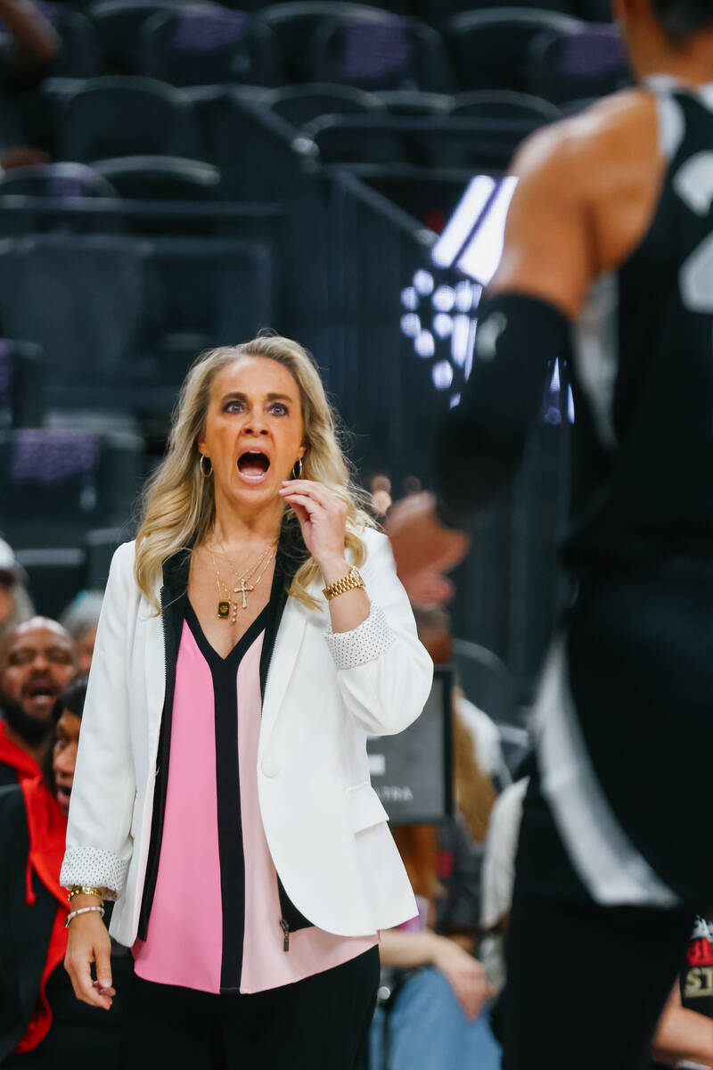 Aces head coach Becky Hammon speaks with Aces center A'ja Wilson (22) during the second ha ...