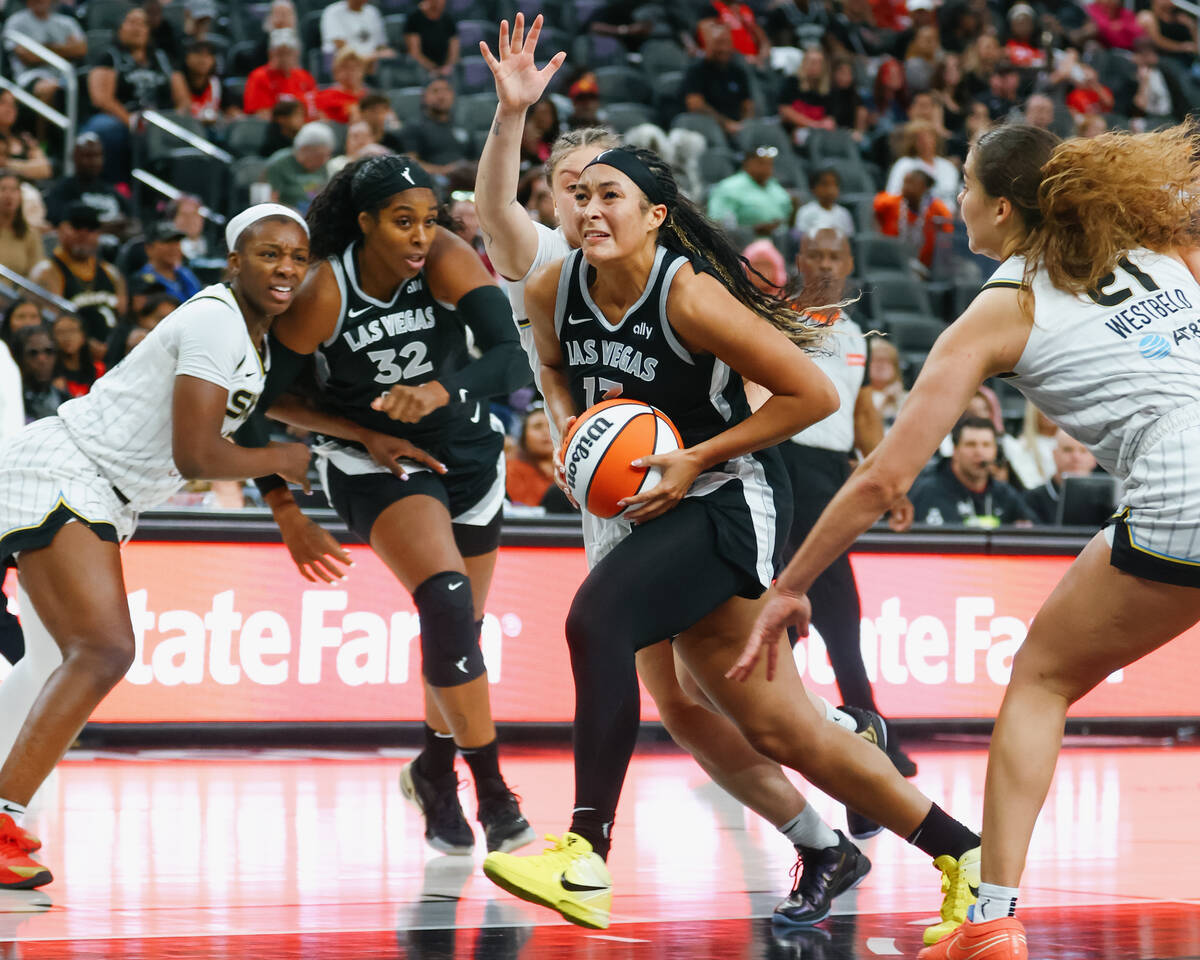 Aces guard Aaliyah Nye (13) drives up toward the basket during the second half of the Aces&#x20 ...