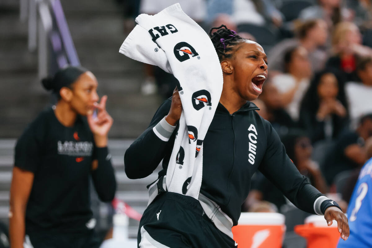 Aces guard Chelsea Gray (12) cheers from the sidelines as the Aces score again during the secon ...