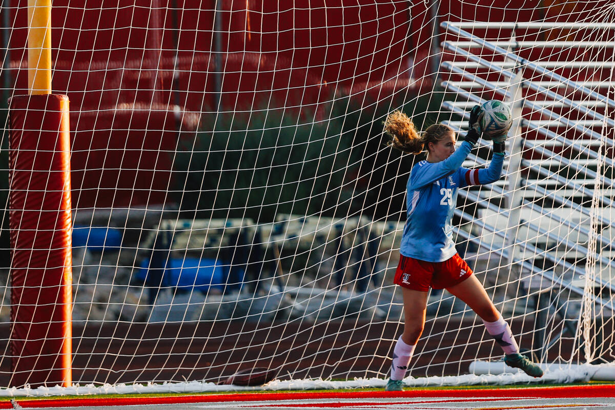 Liberty goalkeeper Brooke Kramer makes a save during a girls soccer game between Liberty and Ar ...