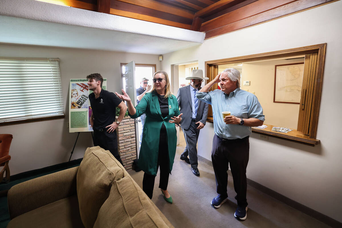 Clark County Museums Administrator Amber Culver, middle, gives Clark County Commission Chair Ti ...