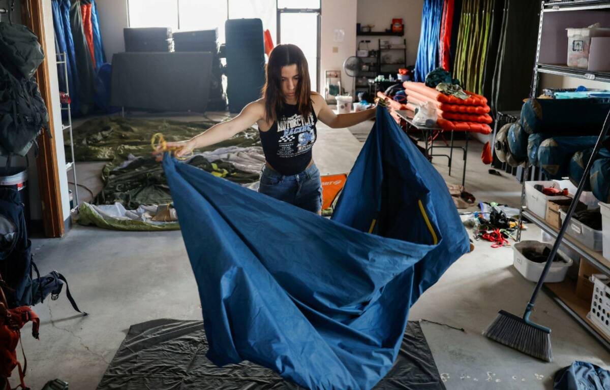 Rentals manager Kamila Duarte disassembles a tent at Basecamp Outdoor Gear on Thursday, Sept. 4 ...