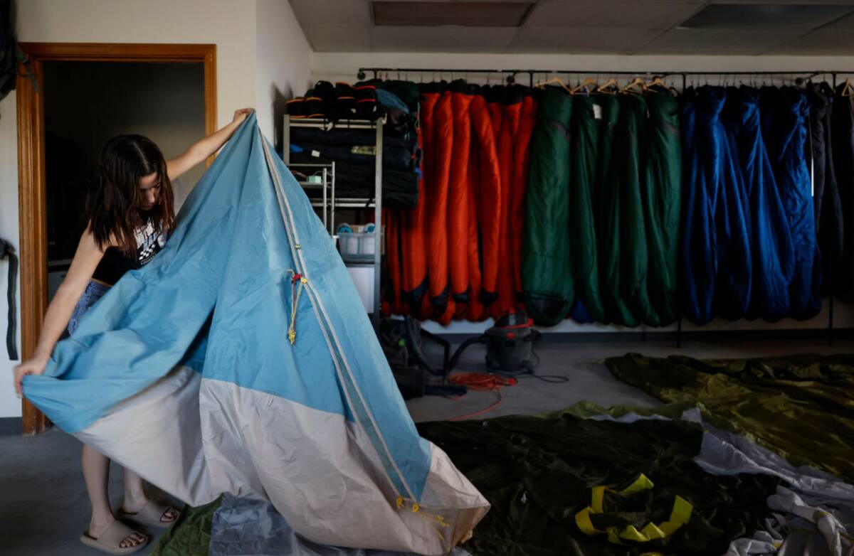 Rentals manager Kamila Duarte disassembles a tent at Basecamp Outdoor Gear on Thursday, Sept. 4 ...