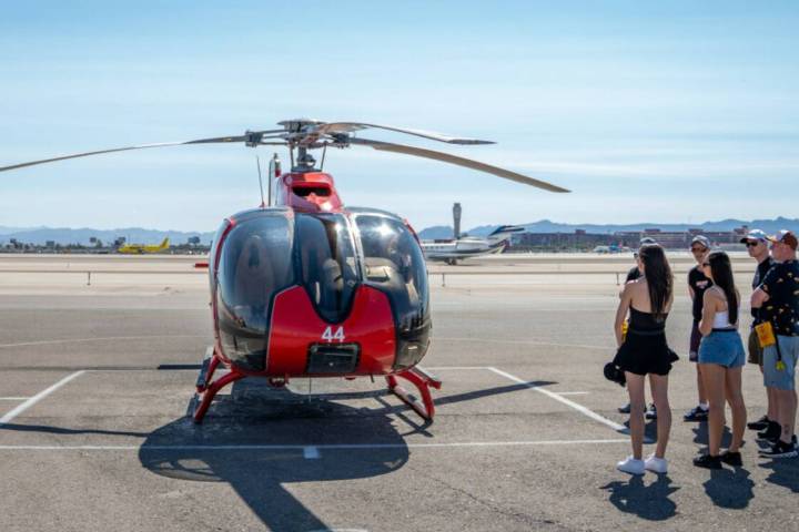 Passengers from the U.K. and Australia board a ‘King of Canyons’ tour at Papillon Helicopte ...