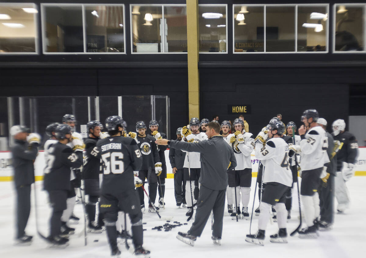 Golden Knights players get coached up during a break at rookie camp at City National Arena Thur ...
