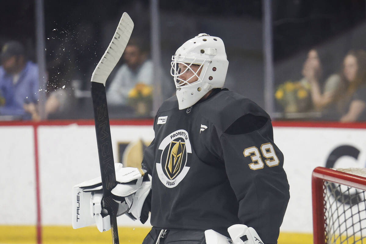 Golden Knights goaltender Cameron Whitehead (39) knocks ice off his stick during rookie camp at ...