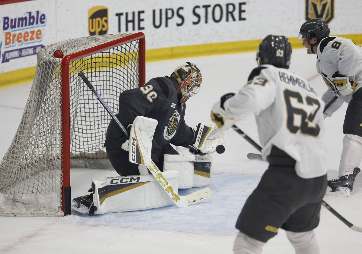 Golden Knights goaltender Carl Lindbom (30) makes a save against center Mathieu Cataford (8) du ...