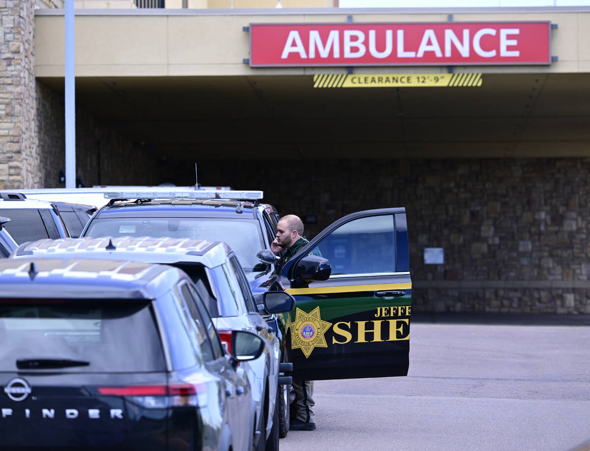 A Jefferson County, Colo., Sheriffs Department deputy is stationed outside of the St. Anthony&# ...