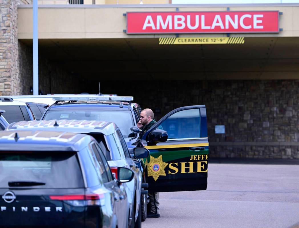 A Jefferson County, Colo., Sheriffs Department deputy is stationed outside of the St. Anthony&# ...