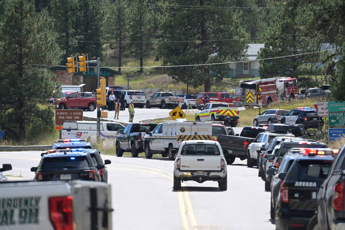 Law enforcement and emergency personnel respond to a shooting at Evergreen High School in Everg ...