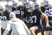 Raiders tight end Michael Mayer (87) runs a drill in front of head coach Pete Carroll during th ...