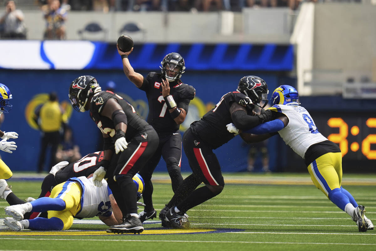 Houston Texans quarterback C.J. Stroud (7) passes against the Los Angeles Rams during the first ...