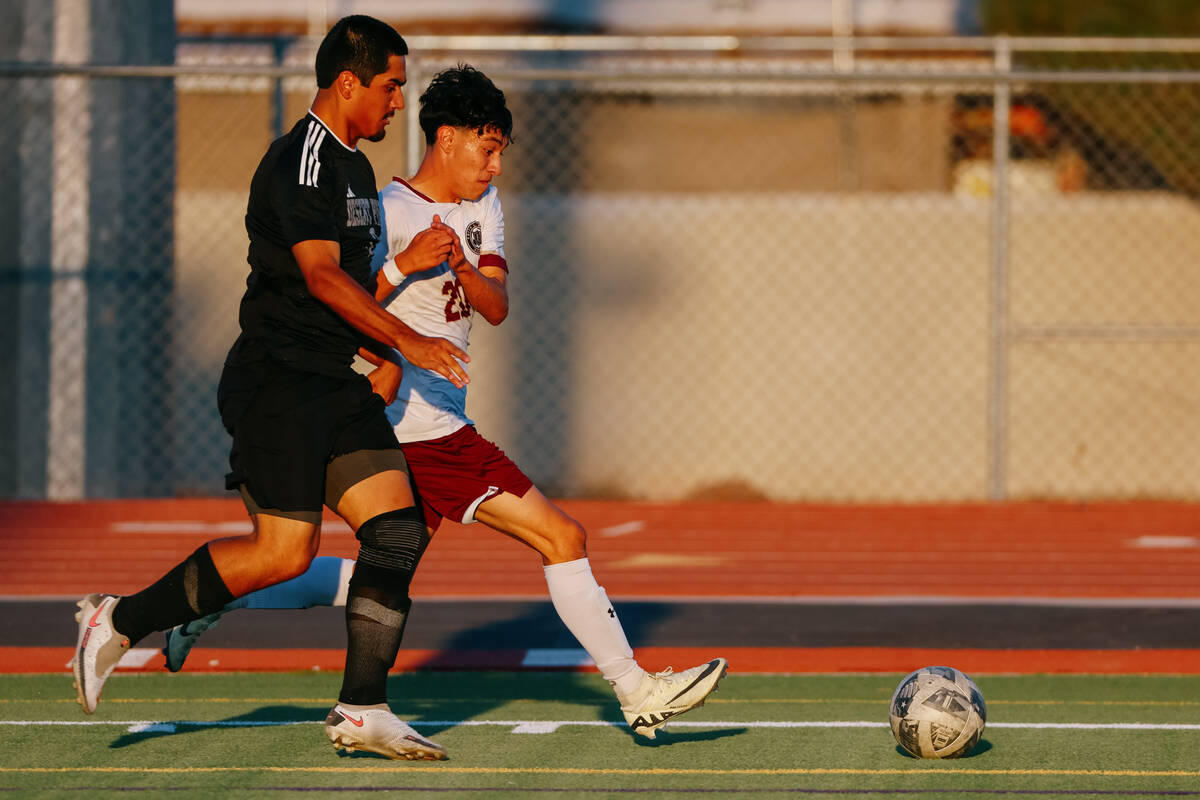 Faith Lutheran midfielder Jayden Serrano (20) sprints against Desert Pines defender Antonio Raz ...