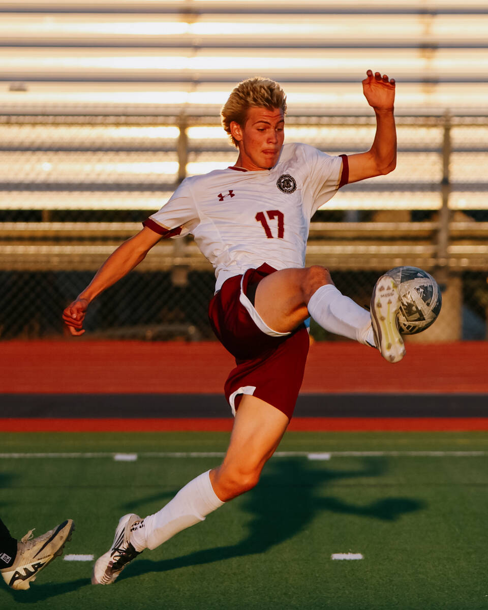 Faith Lutheran forward Tohotom Hajdu (17) takes control of a high ball ball during the soccer g ...