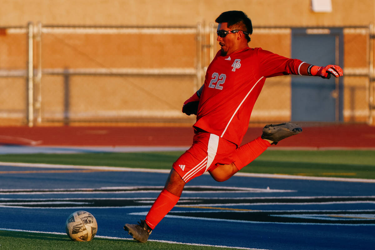Desert Pines goalkeeper Ulises Huerta (22) kicks to his team during the soccer game on Thursday ...