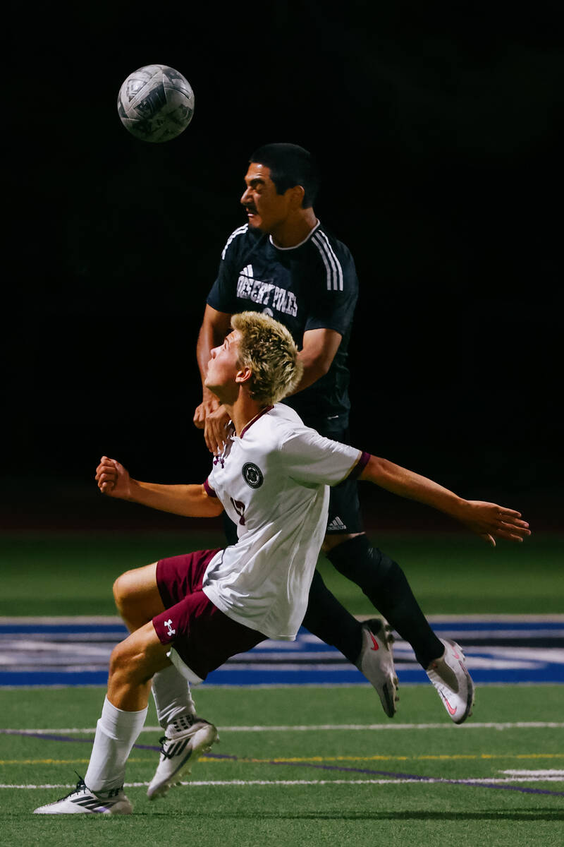 Desert Pines defender Antonio Razo (3) heads the ball away from Faith Lutheran forward Tohotom ...