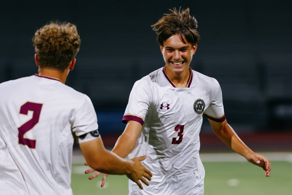 Faith Lutheran defender Vladimir Conic (3) grins as teammate Nicholas Fitzgerald (2) subs in fo ...