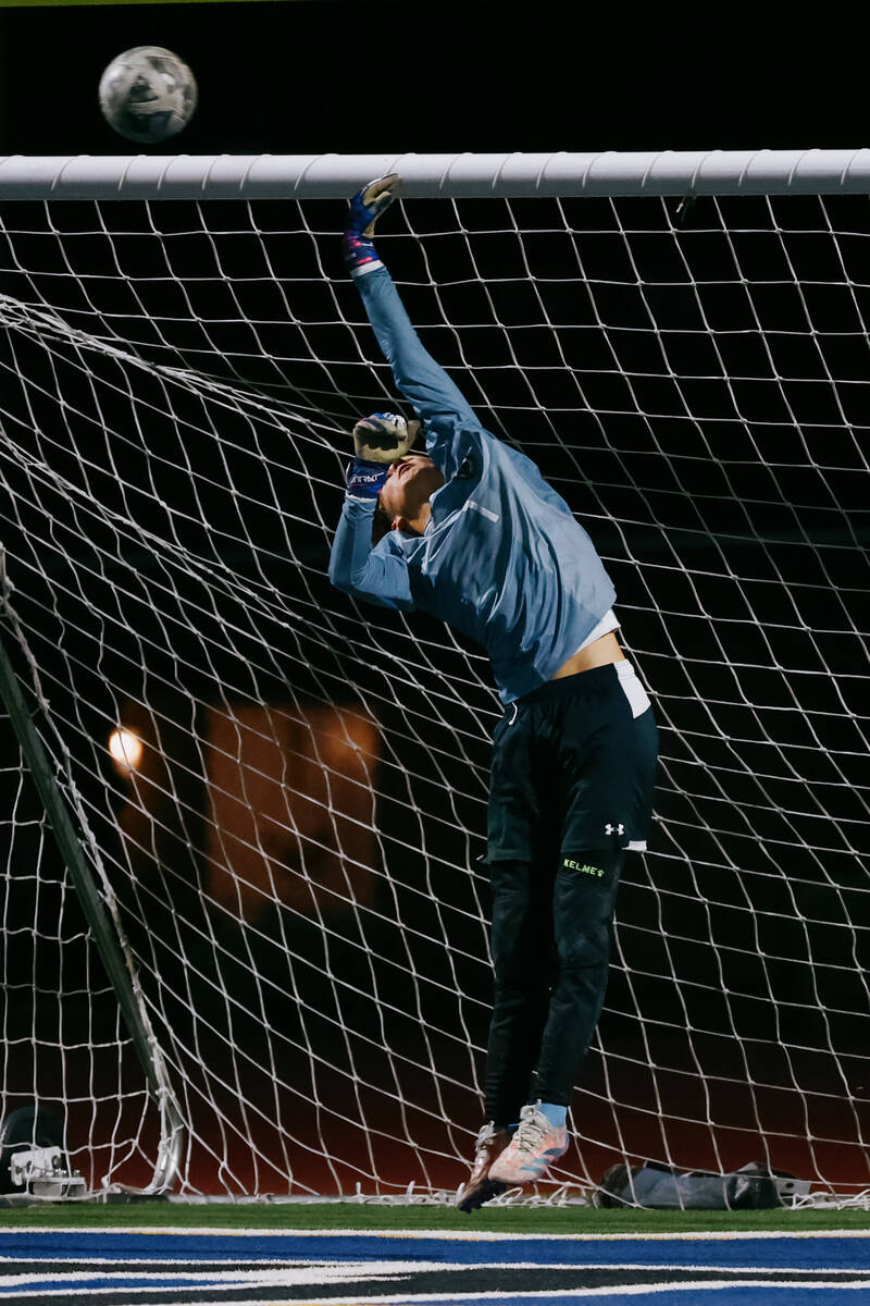 Faith Lutheran goalkeeper Jackson Smith (1) diverts the ball away from goal during the soccer g ...