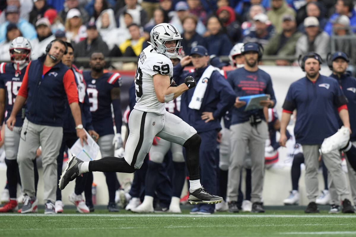 Las Vegas Raiders tight end Brock Bowers (89) runs with the ball against the New England Patrio ...