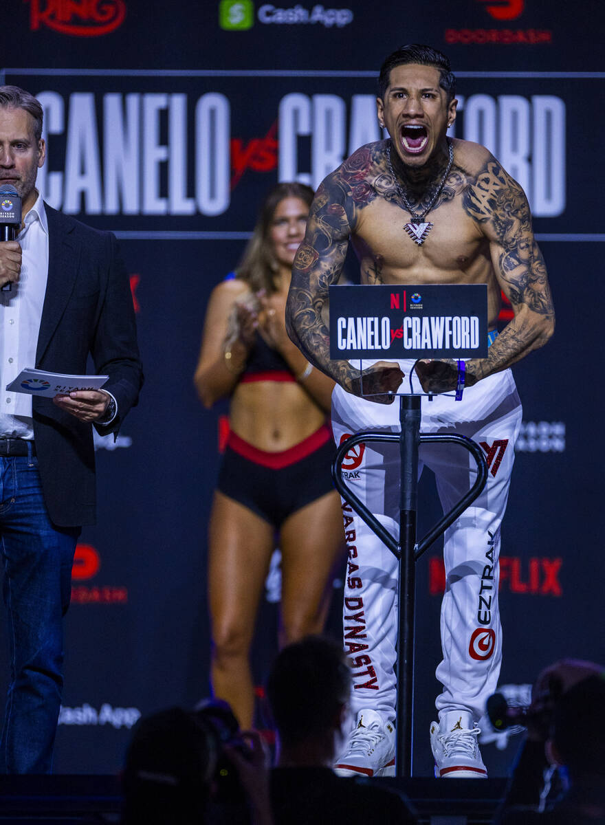 Middleweight fighter Fernando Vargas Jr. flexes for the crowd during weigh ins for his fight ag ...
