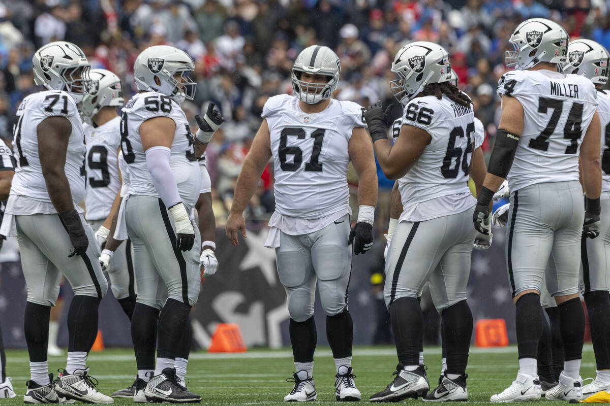 Raiders offensive linemen, from left, DJ Glaze (71), Jackson Powers-Johnson (58), Jordan Meredi ...