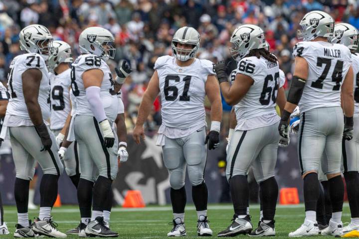 Raiders offensive linemen, from left, DJ Glaze (71), Jackson Powers-Johnson (58), Jordan Meredi ...