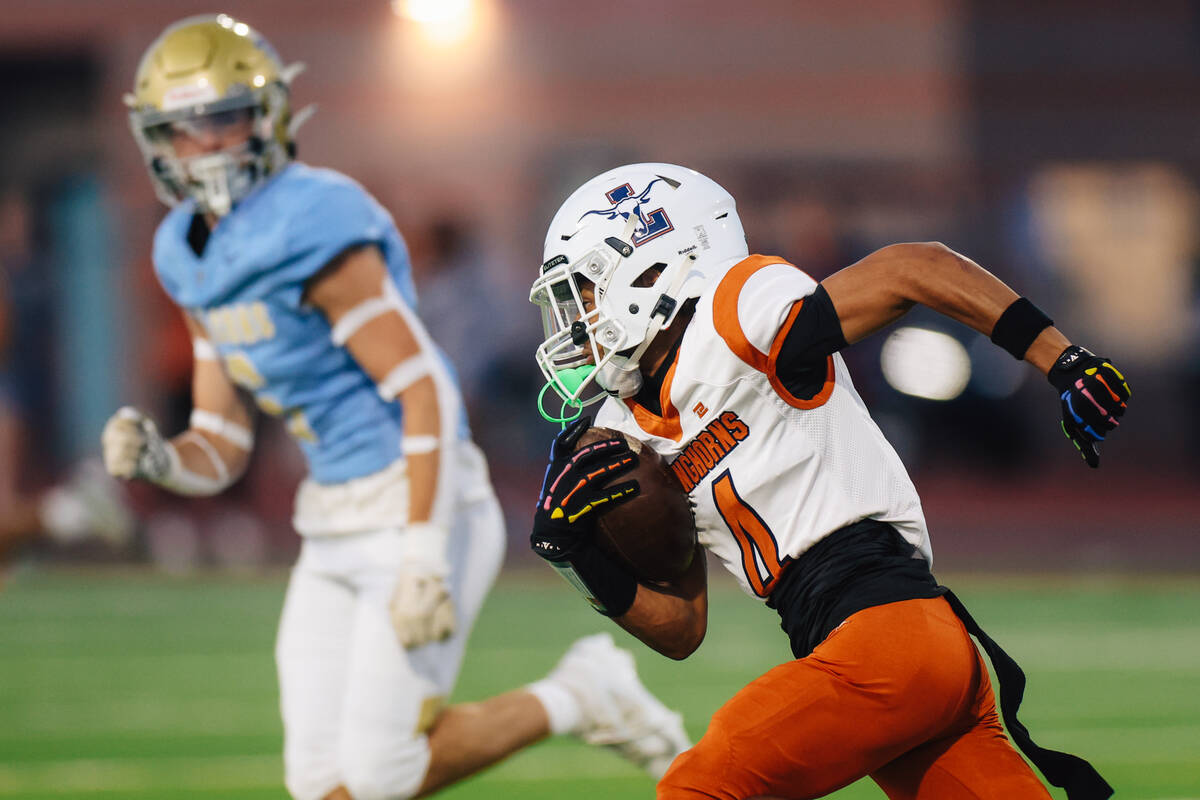 Legacy wide receiver Ky'Ree Perkins runs the ball during a football game between Foothill ...