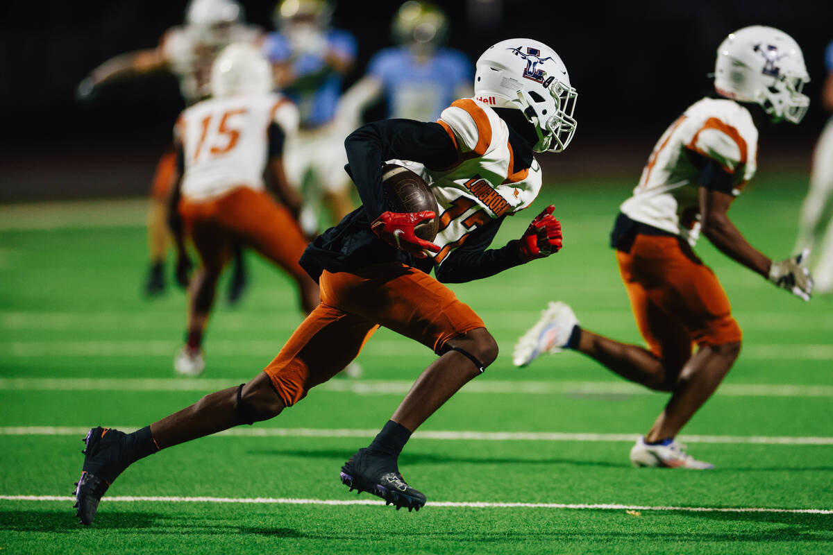 Legacy defense back Jayden Durr runs the ball during a football game between Foothill and Legac ...