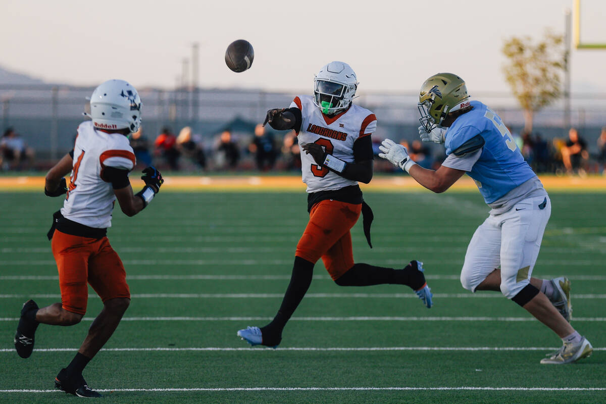 Legacy quarterback JaeLynn Love-Carter (3) throws the ball to wide receiver Ky'Ree Perkins ...