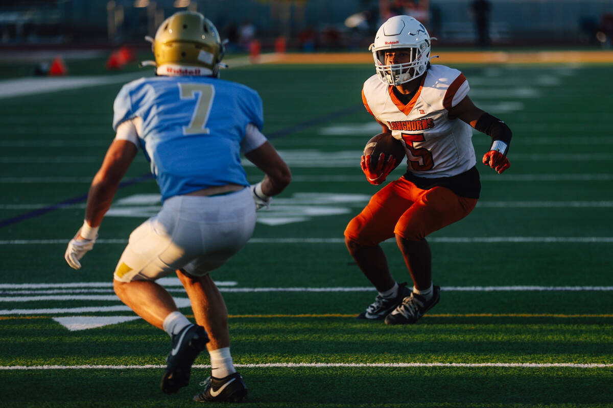Legacy running back Zaione Henderson (5) avoids a defender during a football game between Footh ...