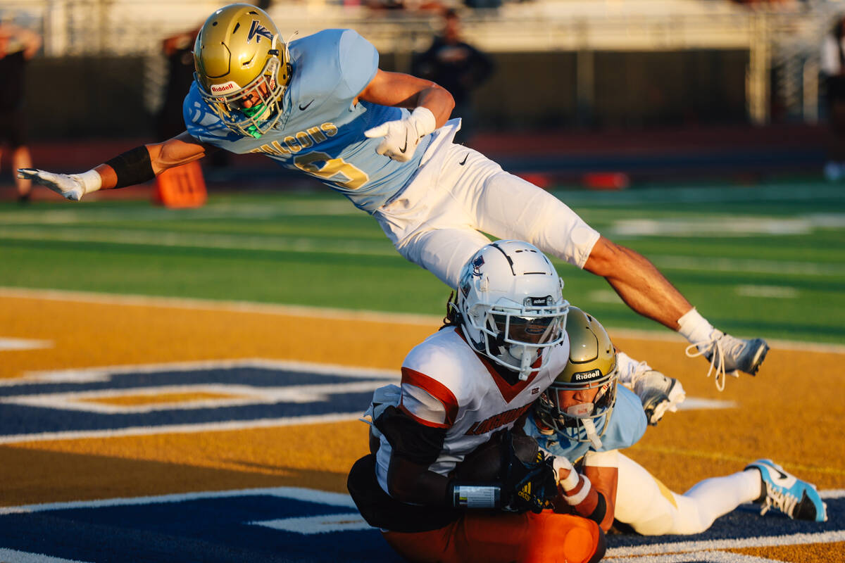 Foothill safety Brody Dobbs (9) leaps over Legacy tight end Jordan Drayton (6) after Drayton&#x ...
