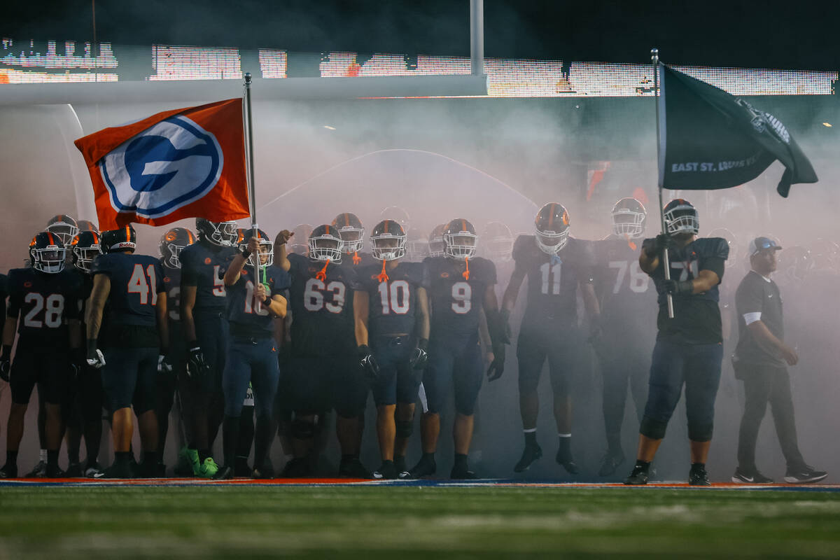 Bishop Gorman players prepare to run out before the football game against East St. Louis on Fri ...