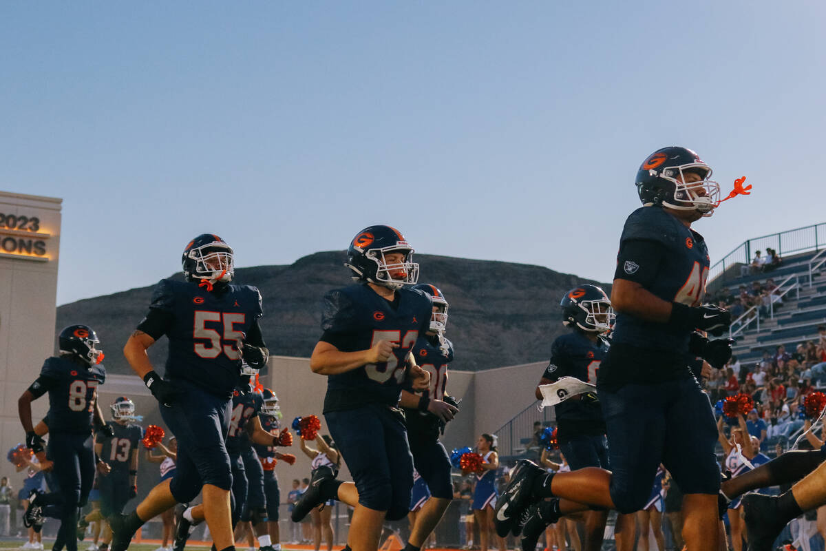 Bishop Gorman players run out before the football game on Friday, Sept. 12, 2025 at Bishop Gorm ...